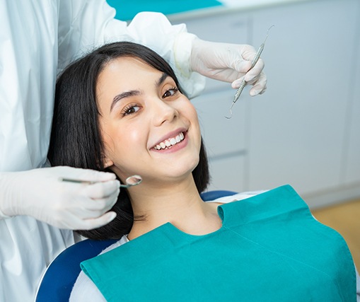 Happy patient undergoing dental exam